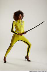 Woman Adult Average Black Fighting with sword Standing poses Casual